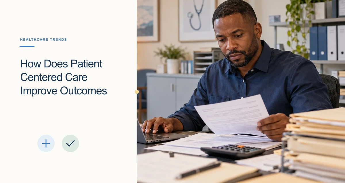 A Black medical billing specialist reviews paperwork beside a laptop and calculator at a clinic operations desk.