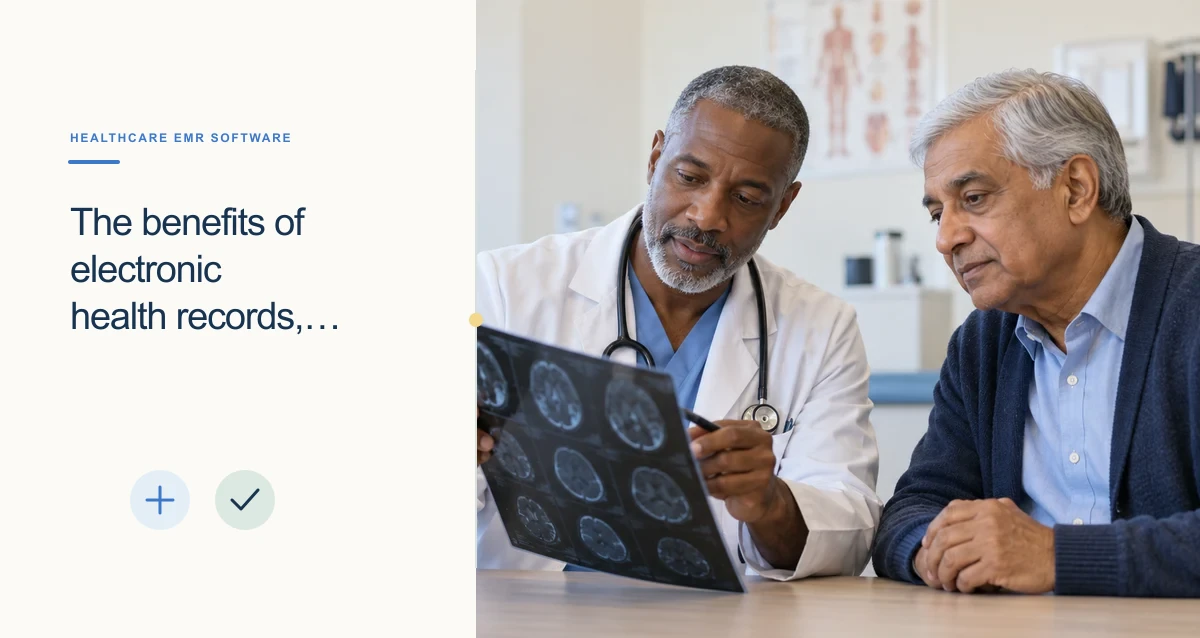 A Black physician and an older South Asian patient examine imaging together at a clinic table.