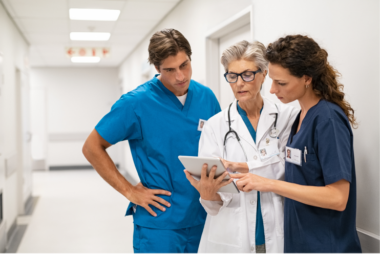 doctor using emr system with other staff