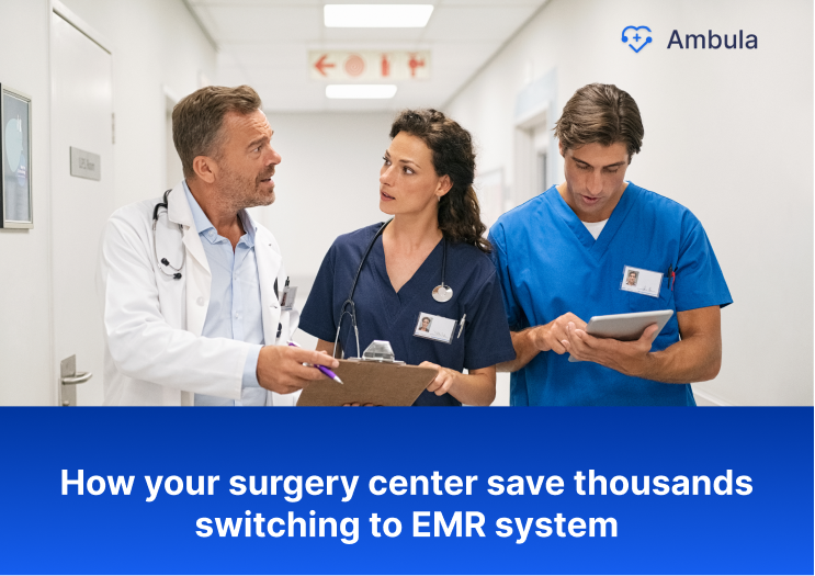 doctors-using-emr-system-at-surgery-center-in-hallway
